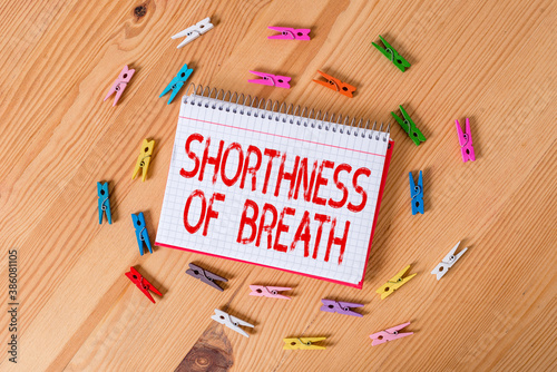 Handwriting text writing Shorthness Of Breath. Conceptual photo intense tightening of the airways causing breathing difficulty Colored clothespin papers empty reminder wooden floor background office photo