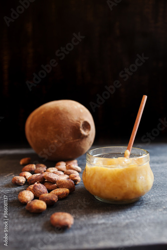 Cupuacu fruit with seeds and jam on a black background. Substitute of cacao, cocoa photo