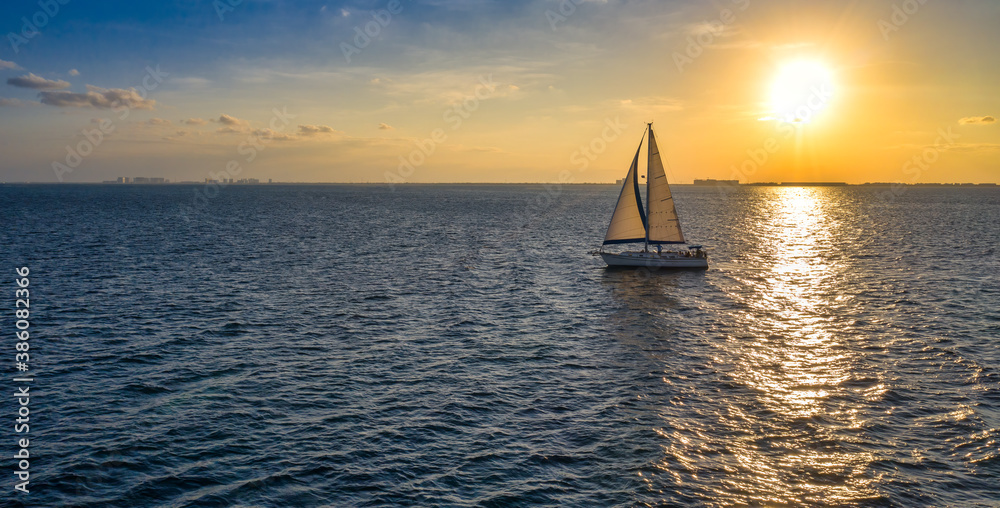 sailing in ocean during sunset
