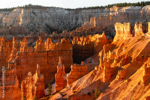 Red rock sandstone spires filled with morning sunlight in Bryce Canyon National Park, Utah