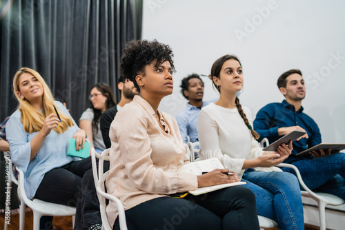 Creative business people listening to colleague.