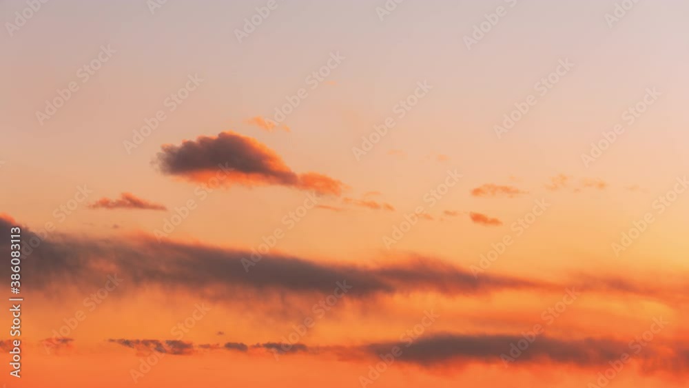 Sunset Sky. Bright Dramatic Sky With Fluffy Clouds. Yellow, Orange, Colours. Dawn Sky Sunset Sky. Bright Dramatic Sky With Fluffy Clouds. Yellow, Orange, Colours. Dawn Sky