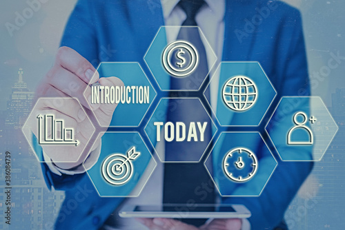 Conceptual hand writing showing Introduction. Concept meaning act or process of introducing : the state of being introduced Grids and different icons latest digital technology concept photo