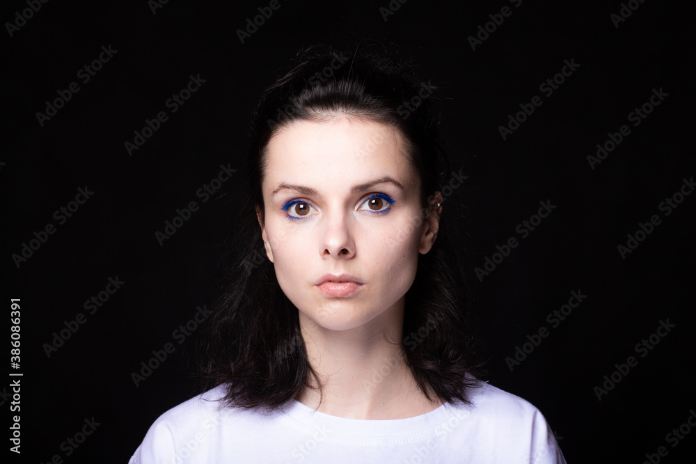 woman in white t-shirt, studio background woman in white t-shirt, studio background