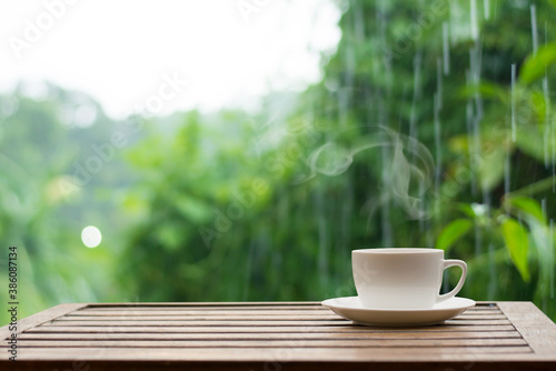 Close up coffee espresso on wood table nature background in garden,