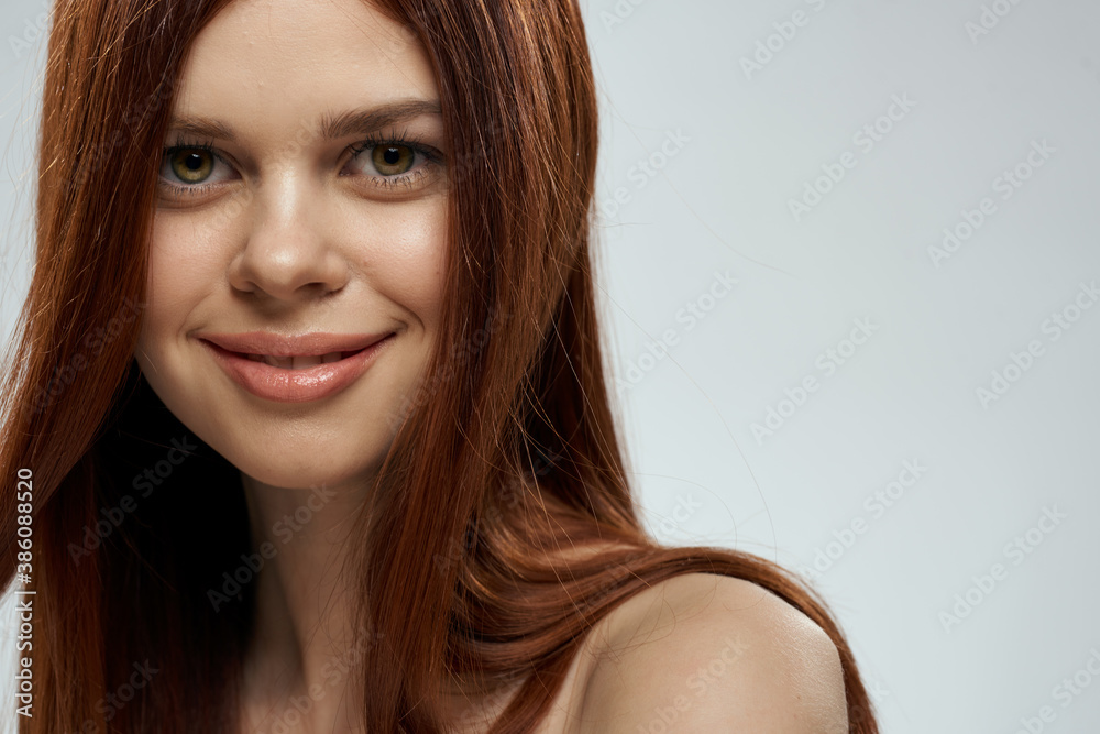 Woman with beautiful long hair care nude shoulders cosmetics cropped view light background Woman with beautiful long hair care nude shoulders cosmetics cropped view light background