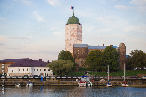 View of the Vyborg Castle from the South Harbor on an October evening. Leningrad region, Russia