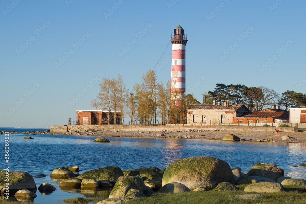 View of Shepelevskiy lighthouse on a sunny May evening. Leningrad region, Russia