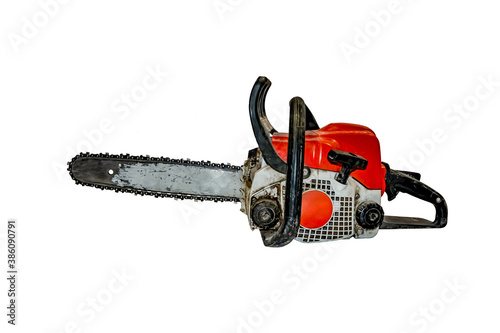 Old dirty shabby chainsaw isolated on white background - side view. Working gasoline tool for sawing wood photo