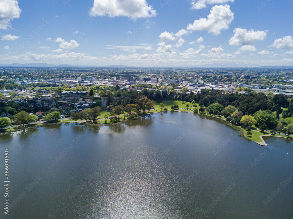 Aerial view over Lake Rotoroa (Hamilton Lake) looking towards Hamilton CBD, in the Waikato region of New Zealand