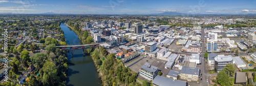 Aerial drone panoramic view looking at the Claudelands Bridge over the Waikato River as it cuts through the city of Hamilton, in the Waikato region of New Zealand