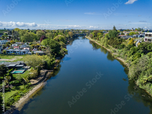 Aerial drone view looking at Victoria Bridge over the Waikato River as it cuts through the city of Hamilton  in the Waikato region of New Zealand