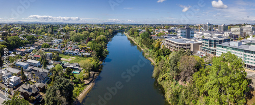 Aerial drone panoramic view looking at Victoria Bridge over the Waikato River as it cuts through the city of Hamilton, in the Waikato region of New Zealand