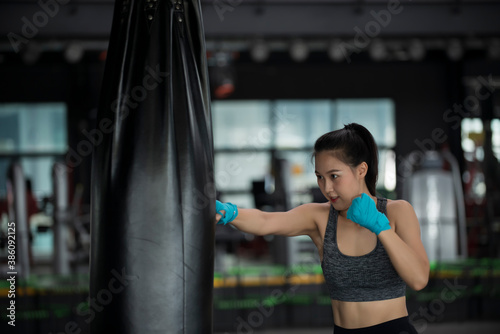 woman exercising in gym © VIEWFOTO STUDIO