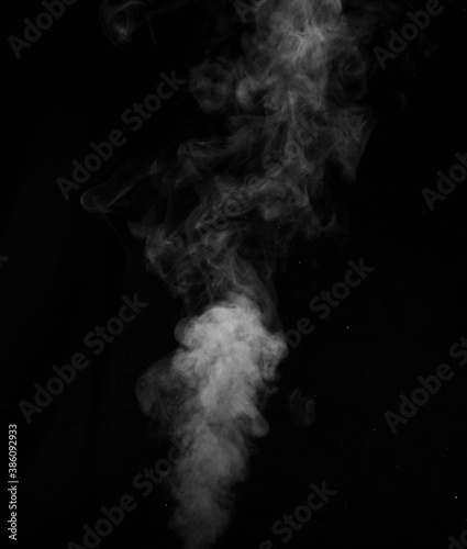 Figured smoke on a dark background. Abstract background, design element, for overlay on pictures
