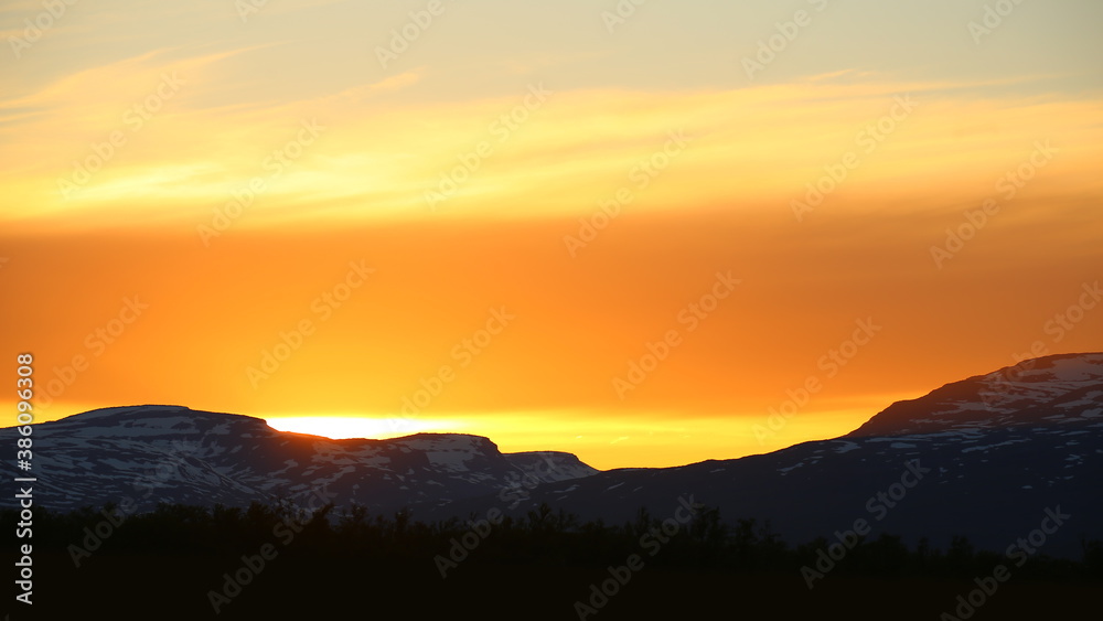 Orange sunset in Norrbotten in northern Sweden