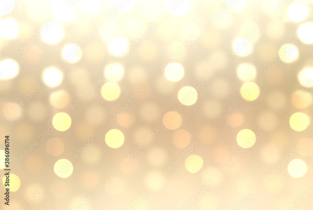 Xmas bokeh beige pattern. Holiday background with bright lights of garland. Xmas bokeh beige pattern. Holiday background with bright lights of garland.