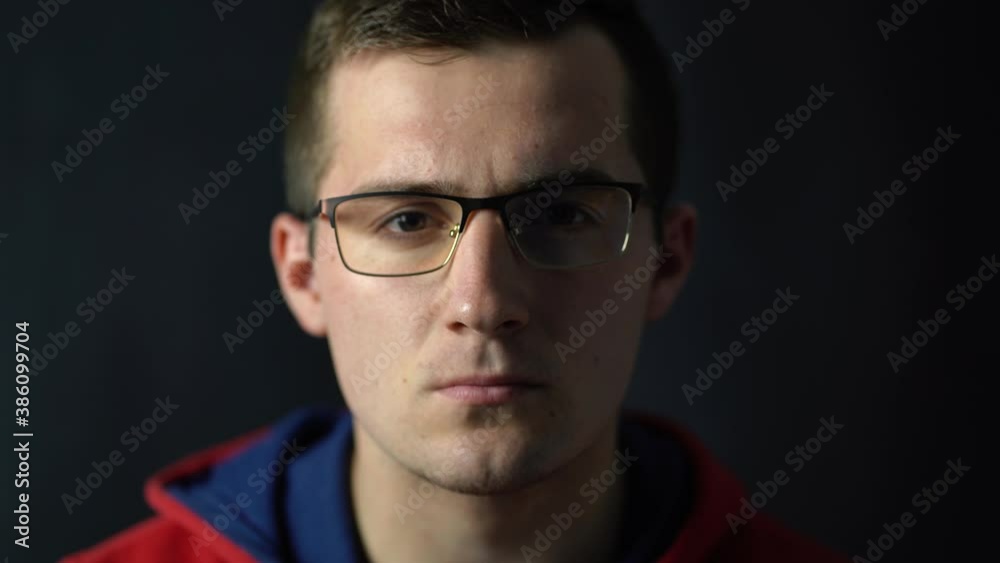 man raises his head menacingly looking at the camera man raises his head menacingly looking at the camera