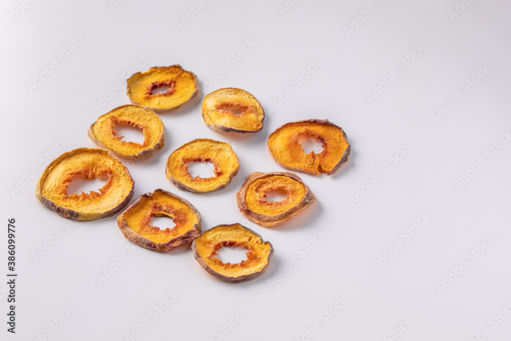 slices of dried peach on a white background. dried fruits. eco. top view.
