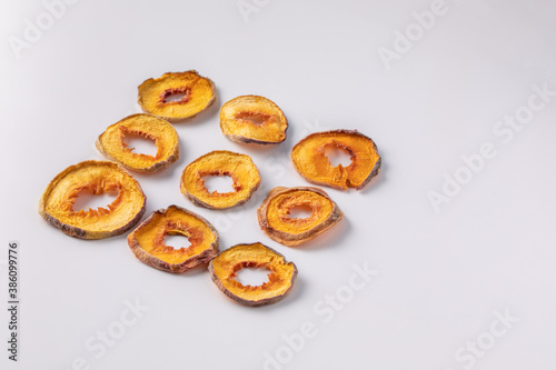 slices of dried peach on a white background. dried fruits. eco. top view.