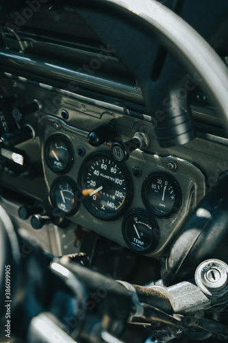 Close up detail shot of an old utility vehicle dashboard.