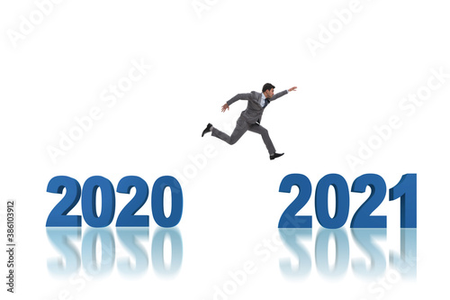 Businessman jumping from the year 2020 to 2021 © Elnur