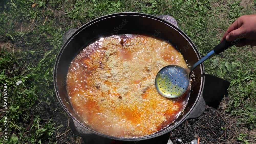 pilaf in a cauldron oriental dish on live fire pilaf in a cauldron oriental dish on live fire
