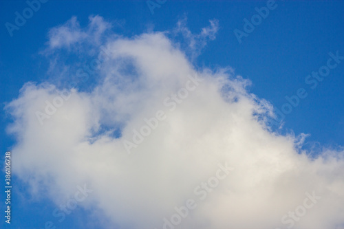 Soft white clouds and blue sky background.