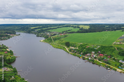 Aerial view of the Khokhlovka on the river of Kama. Perm Krai, Russia. River mouth, a village in Russia.