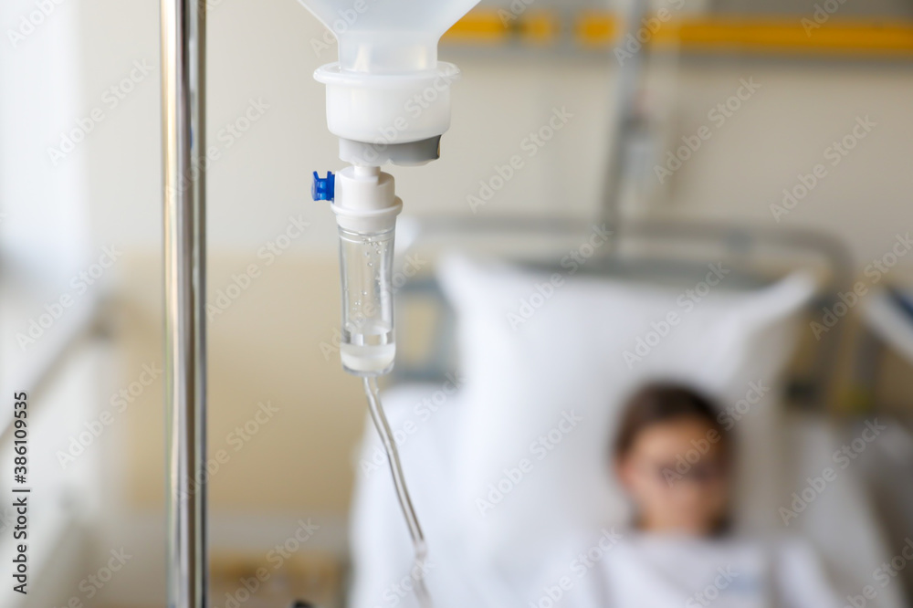 Saline drip medical, Dripping of IV solution, Intravenous therapy for patient in hospital that delivers fluids directly into vein, fastest way to deliver medications fluid. Horizontal, copy space Saline drip medical, Dripping of IV solution, Intravenous therapy for patient in hospital that delivers fluids directly into vein, fastest way to deliver medications fluid. Horizontal, copy space