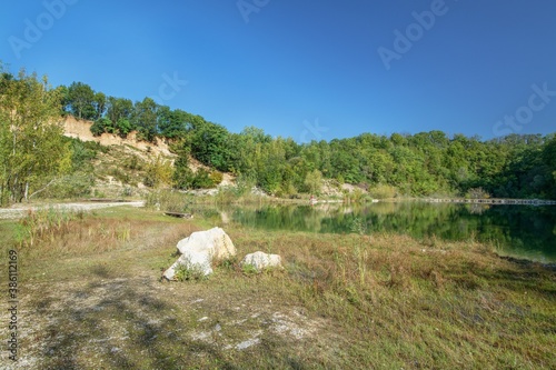 Kurovice. Old flooded quarry. South view. East Moravia. Czechia. Europe.