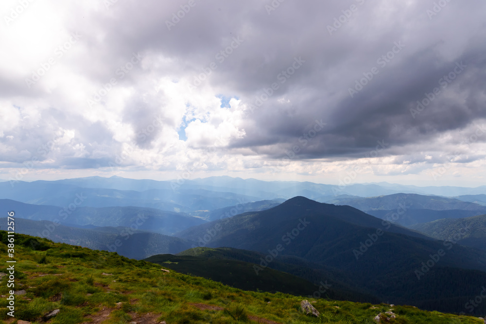 Fototapeta premium Beautiful low clouds over the mountains. Mountain landscape.