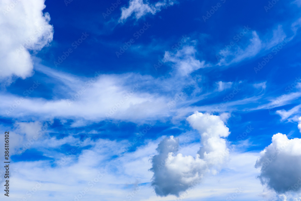 White clouds cumulus floating on blue sky, blue sky background with tiny clouds White clouds cumulus floating on blue sky, blue sky background with tiny clouds