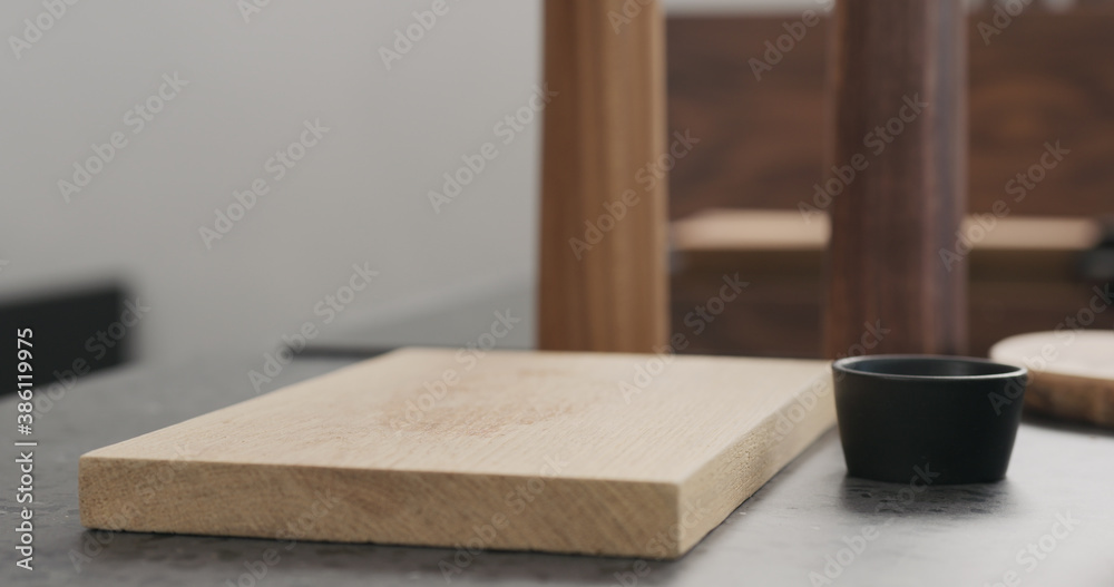 empty oak wood board for steak on concrete countertop