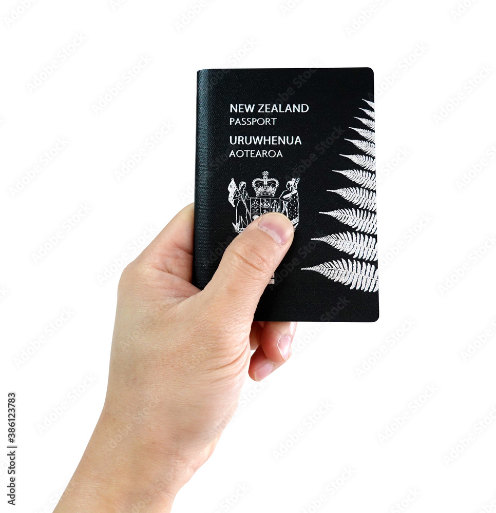Man's hand holding New Zealand passport on white background Stock Photo