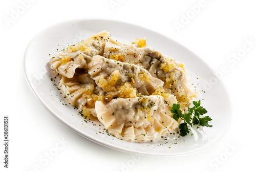 Dumplings - noodles with meat on white background