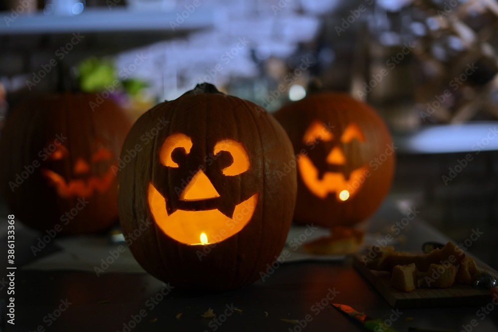 Fototapeta premium Making halloween pumpkin head jack o lantern at home. Do it yourself.