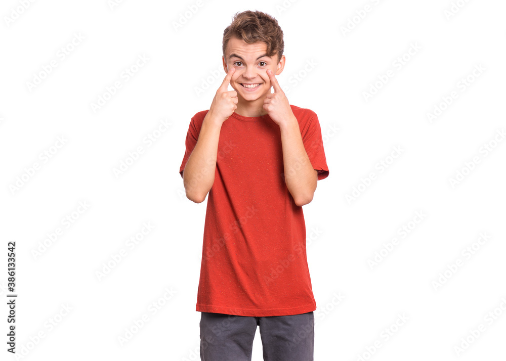 Handsome teen boy showing his eye, isolated on white background Handsome teen boy showing his eye, isolated on white background