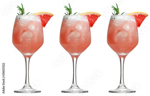 Alcoholic drink with tropical fruits and herbs and ice. Three alcoholic cocktails isolated on white. close up