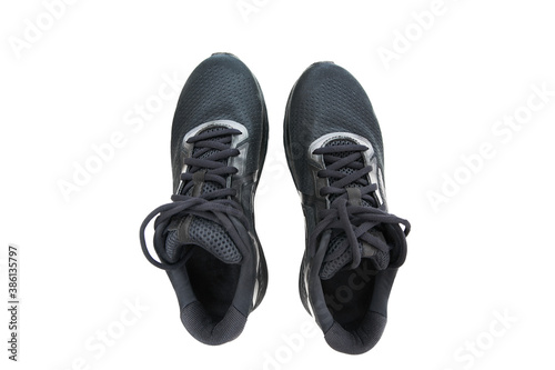 Black running sneakers on white background view from above