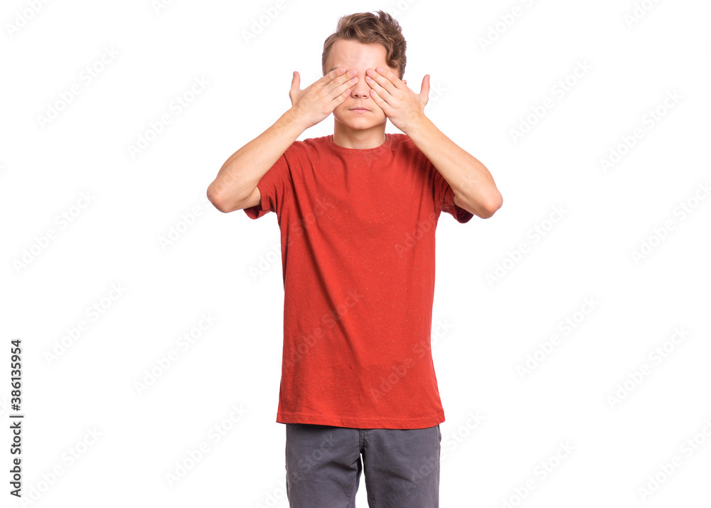 Handsome teen boy with sad expression covering face with hands while crying, isolated on white background Handsome teen boy with sad expression covering face with hands while crying, isolated on white background