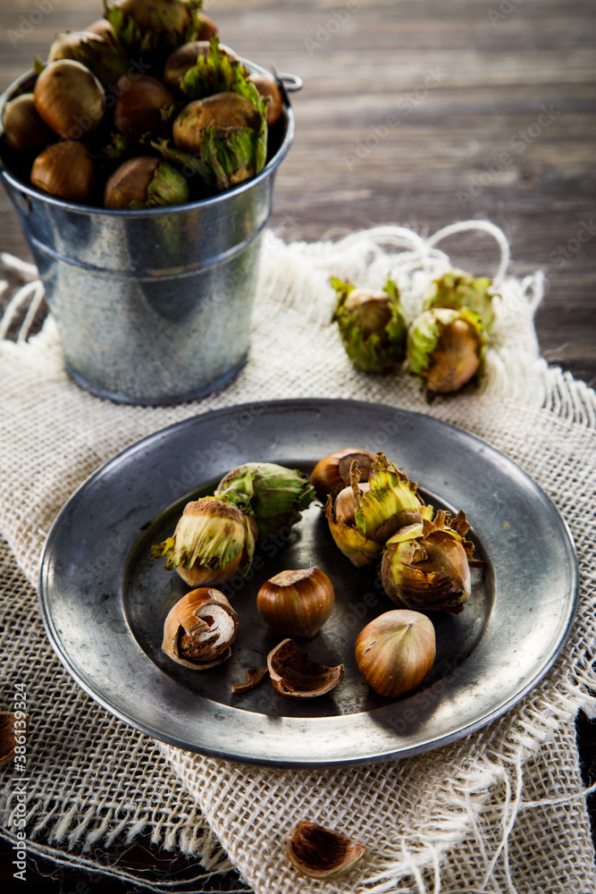 Ripe hazelnuts in shells on wooden table
Ripe hazelnuts in shells on wooden table