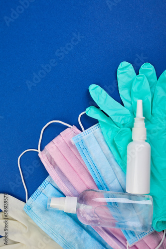 Flat lay of Coronavirus protection, medical protective masks, gloves, hand sanitizer