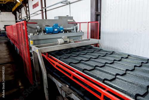 Metal sheet forming machine at the modern metalwork factory.