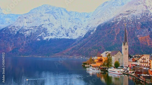 Hallstatt, a charming village on the Hallstattersee lake and a famous tourist attraction, with beautiful mountains surrounding it, in Salzkammergut region, Austria, in winter sunny day.