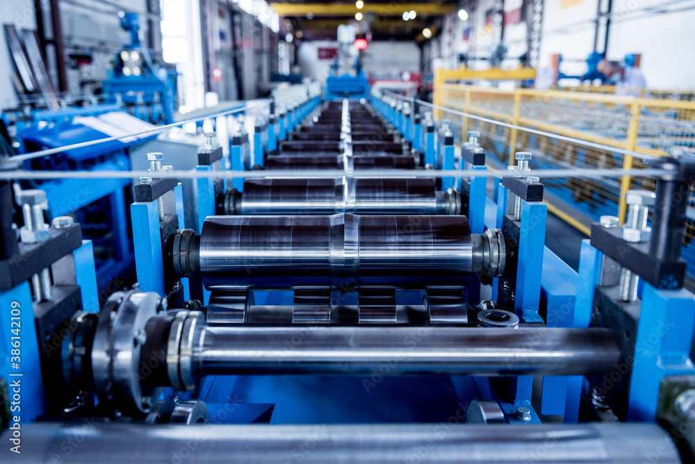 Metal sheet forming machine at the modern metalwork factory. Metal sheet forming machine at the modern metalwork factory.