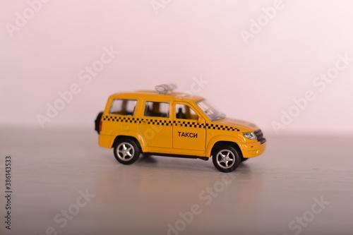 yellow toy car. car, yellow, toy, isolated, auto, taxi, automobile, transportation, vehicle, white, transport, model, old, truck, jeep, vintage, drive, cars, speed, cab, travel, play, road, sport, 