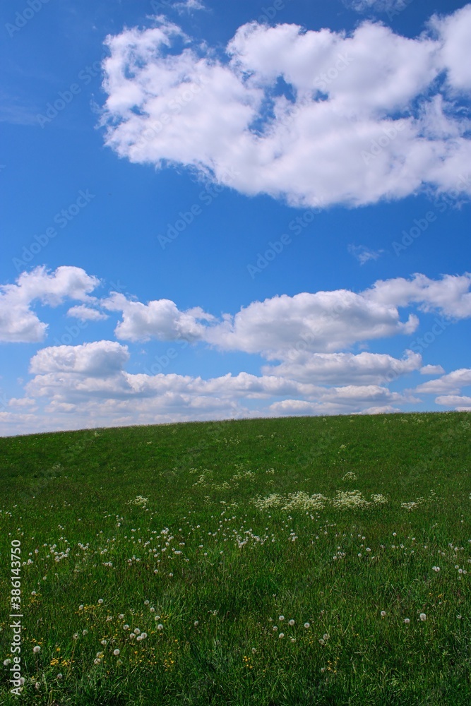 Empty, rural background landscape with clouds