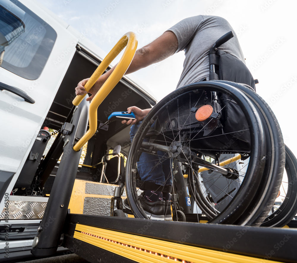 custom made wallpaper toronto digitalA man in a wheelchair on a lift of a vehicle for people with disabilities