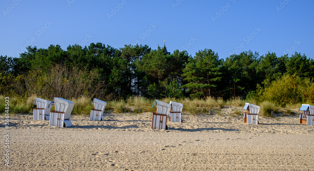 wicker beach chairs on a beach at the baltic sea in usedom, germany wicker beach chairs on a beach at the baltic sea in usedom, germany